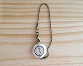 Fake watch with Antiqued Brass bead type chain bracelet. One-of-a-kind handmade Porcelain toy clock.