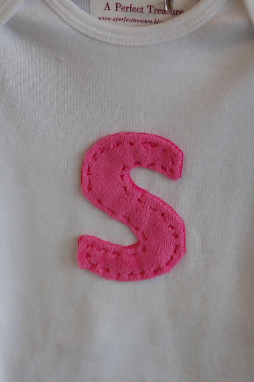 initial onesie.  monogrammed shirt for your favorite little guy or gal.  coupon available.