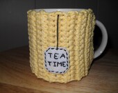 handmade crocheted tea mug cozy or cup cozy in yellow with tea time tag
