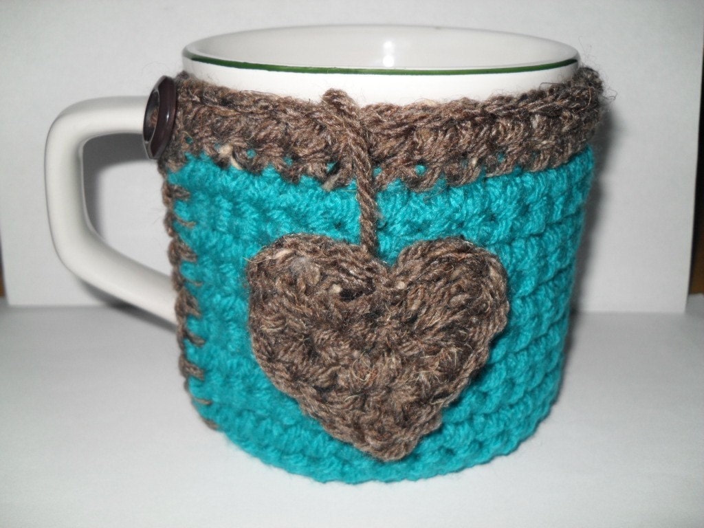 crocheted coffee mug cozy or tea cup cozy in beautiful peacock blue trimmed in barley brown with heart tea bag