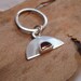 Sterling silver charm ring with bezel set, faceted D shaped garnet