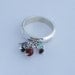 Sterling siver charm ring with emerald, tormaline and garnet beads