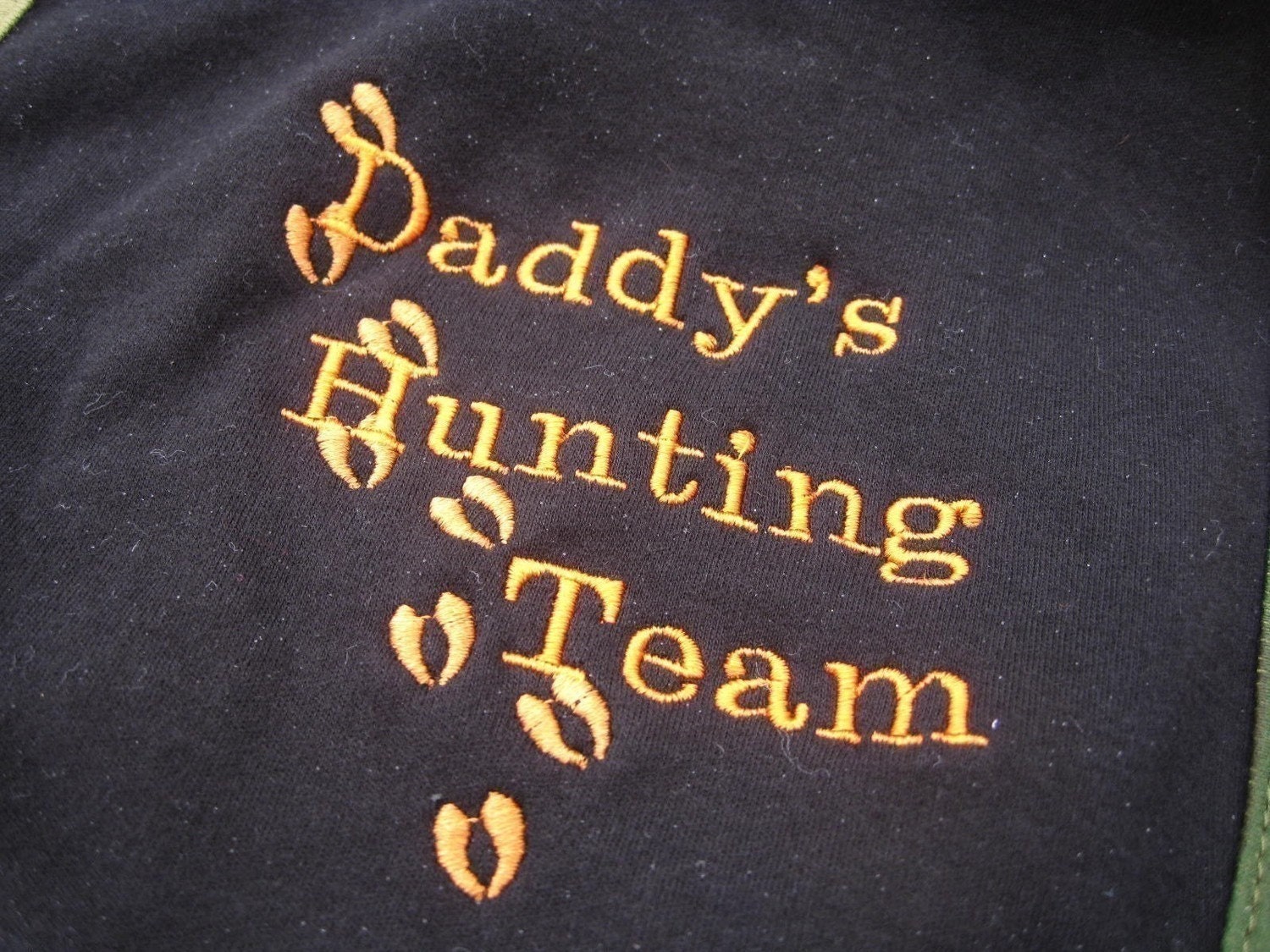Embroidered Deer Hunting Camo Onesies.  Embroidered Deer tracks with the saying This little Runt was born to Hunt