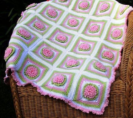 Crochet pattern baby blanket with chrysanthemum flowers and ruffle edge