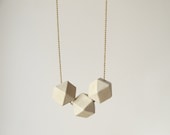 geometric necklace with faceted wooden beads on a puristic fine ballchain