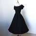 vintage 1950's dress ...pretty BETTY BARCLAY black ruffled bustle back full skirt shoulder skimming shawl collar pin-up cocktail party dress