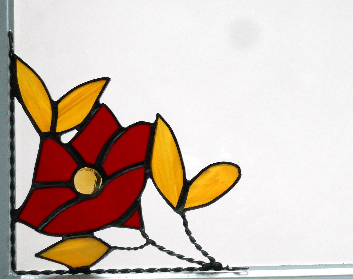 small 5 petal flower / stained glass window corner/ dk red and light amber/ bottom left