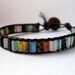 Leather wrap bracelet - tiny rainbow mixed stone with button closure