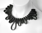 black rubber necklace, rubber jewelry, modern geometric design, avant garde statement piece, bib necklace, black choker, monochrome fashion
