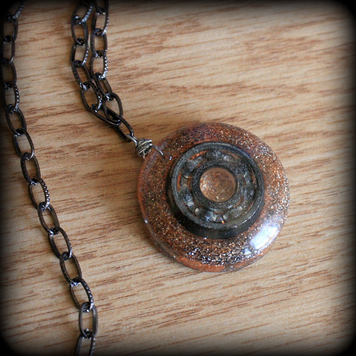 BEARING NECKLACE - Grey and orange glitter and dark silver bearing - hand cast circle shaped resin pendant