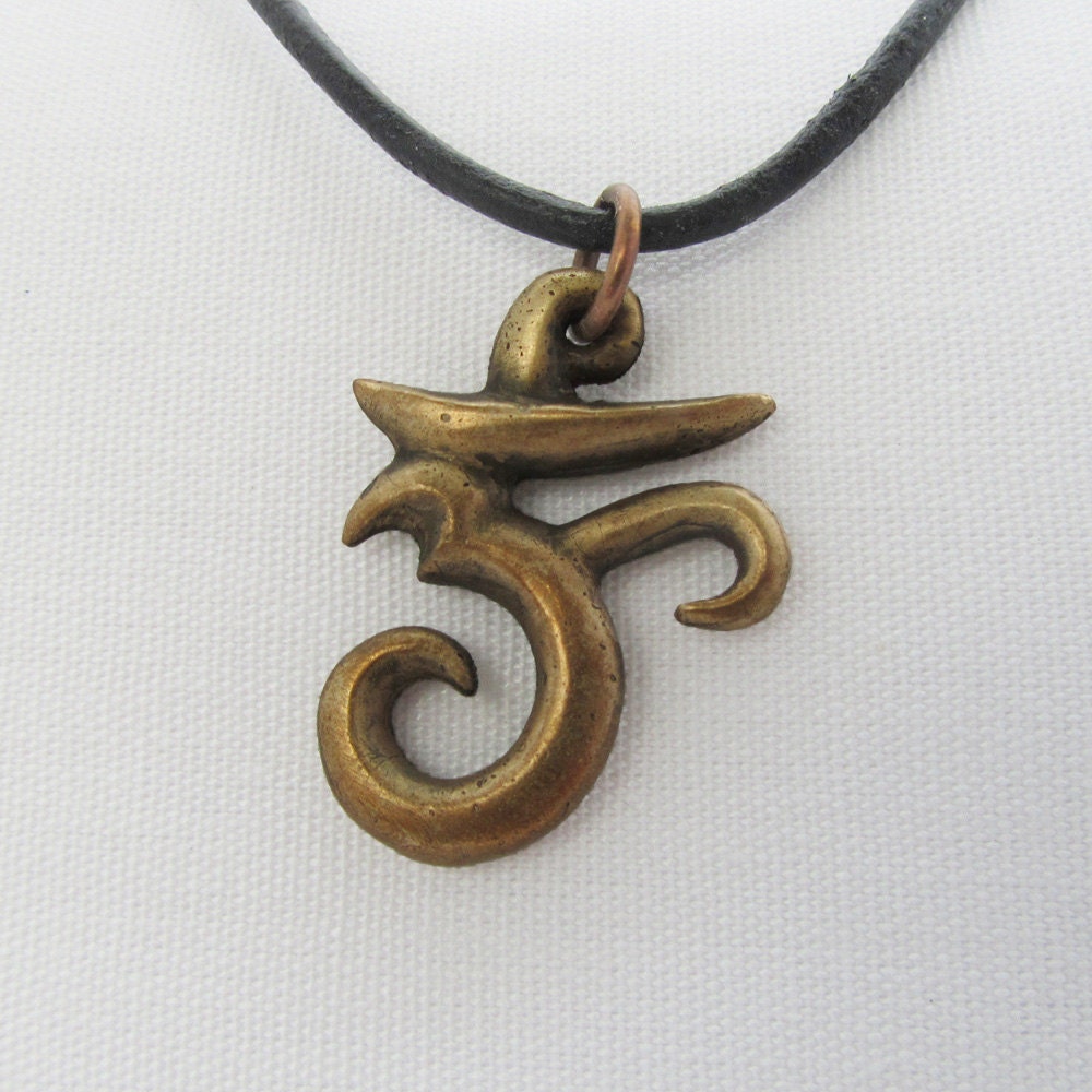 Om in aged bronze