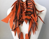 Shredded zebra print orange and brown suede earrings