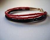 Red and black beaded bracelet with leather -- Stacked Fracture