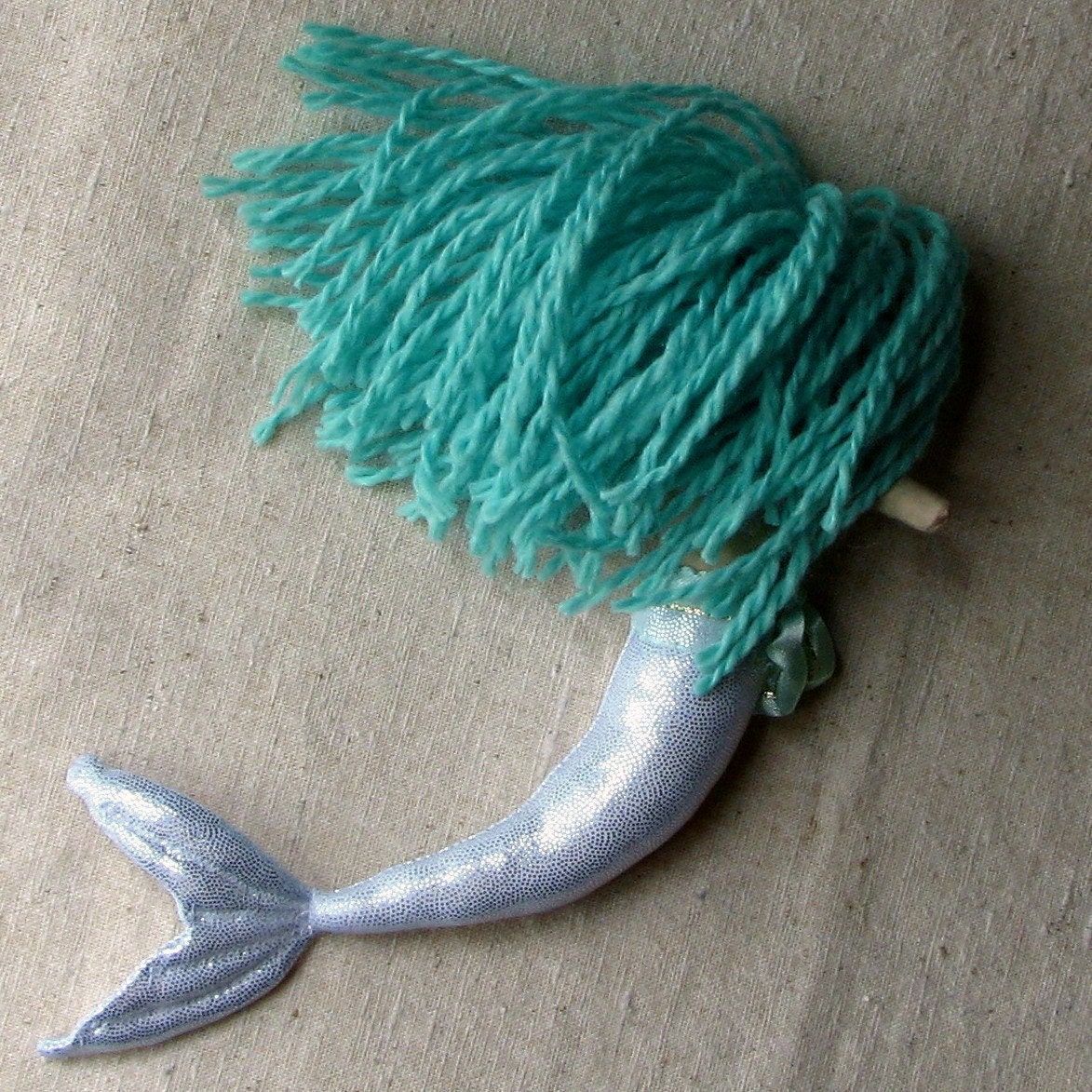 Mermaid doll, sparkly silver fishtail and aqua green hair