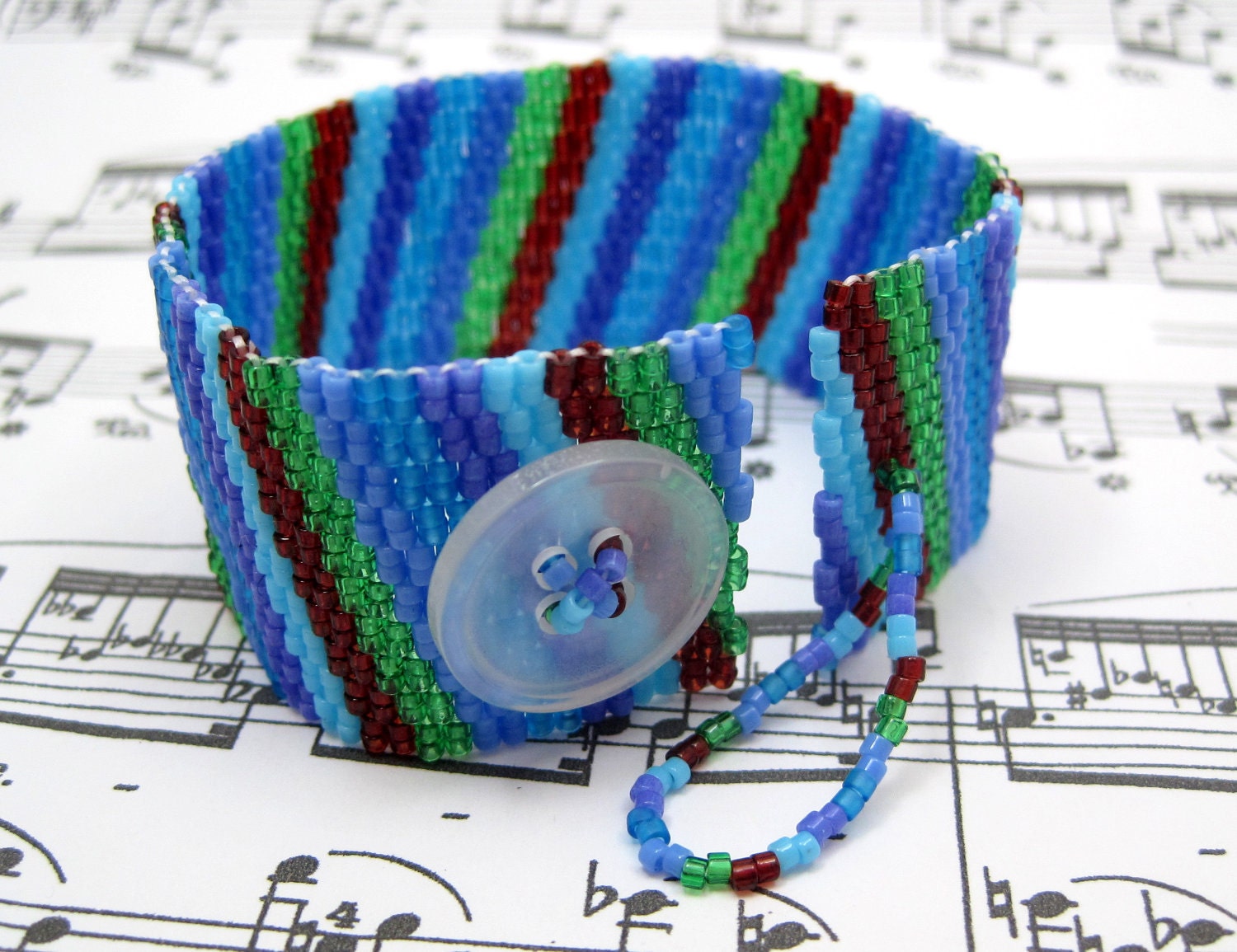 Beaded Cuff Bracelet - Multicolored Colorful Blue Green Purple Dark Red Diagonal Stripe by randomcreative on Etsy