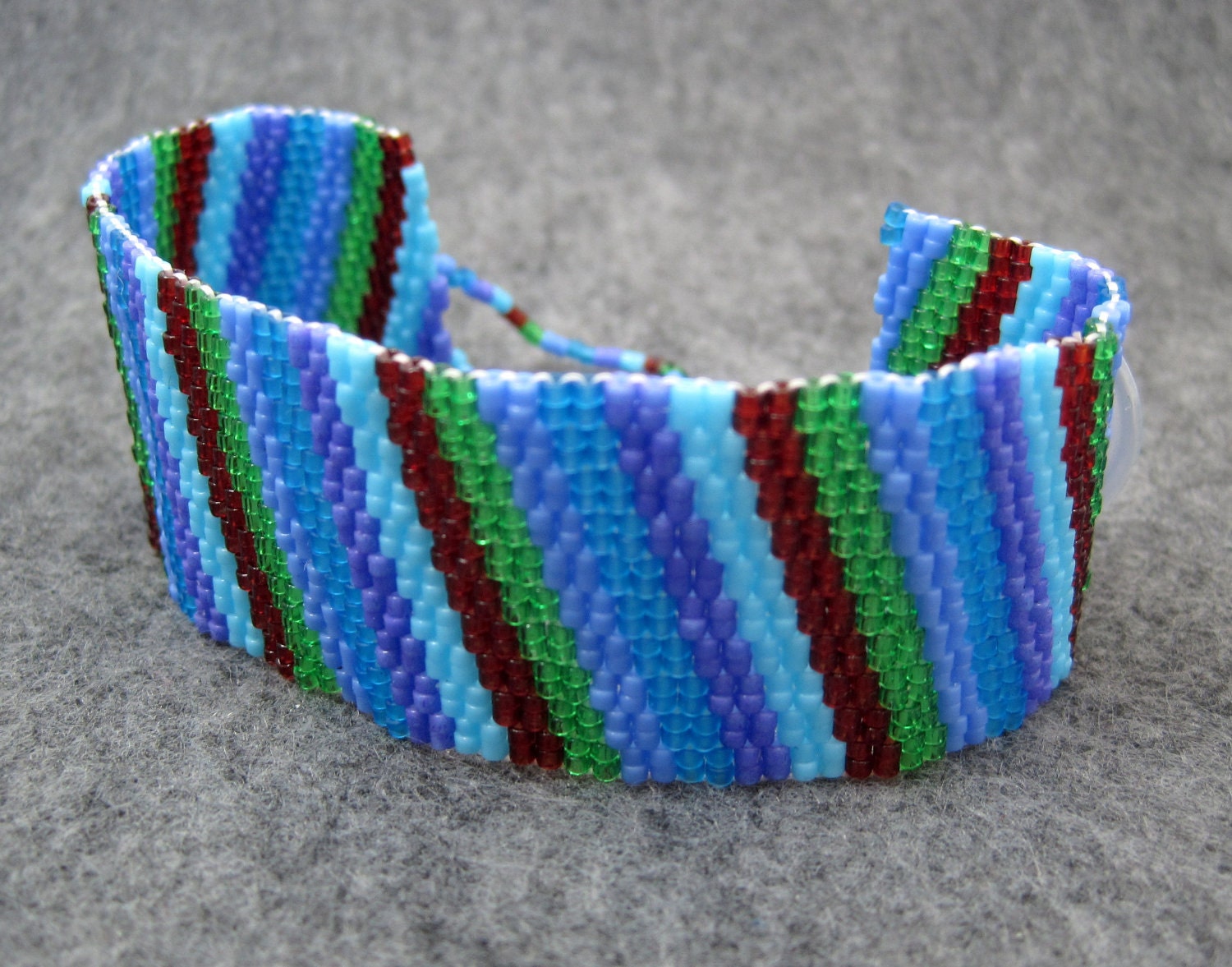 Beaded Cuff Bracelet - Multicolored Colorful Blue Green Purple Dark Red Diagonal Stripe by randomcreative on Etsy