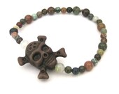 Unisex Skull and Crossbones Stretch Bracelet in brown and earth tones