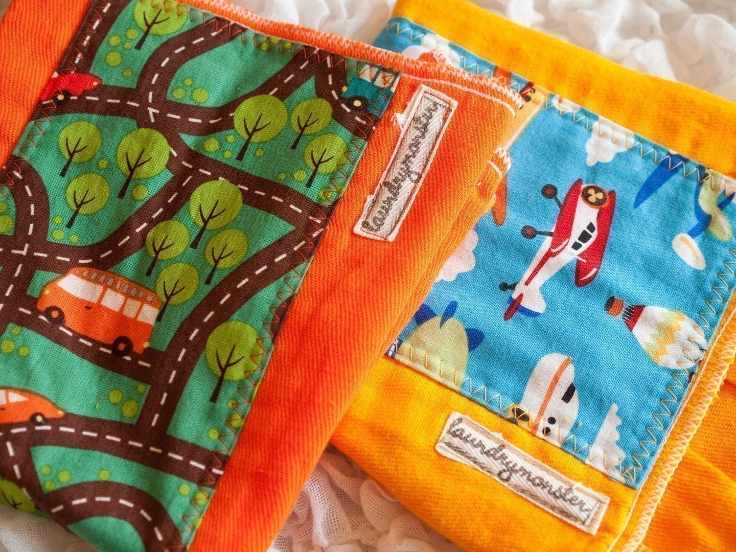 The roadtrip and airship hand dyed burp cloth set in orange and deep yellow