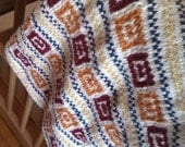 HANDKNIT GEOMETRIC BLANKET.