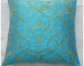 aqua blue pillow cover with yellow filigree embroidery