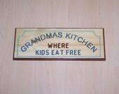 Wood sign Grandmas Kitchen where kids eat free engraved and hand painted.