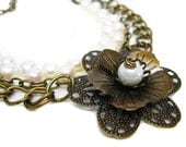 White Pearl Necklace. Antique Brass Triple Strand Necklace. Flower Necklace