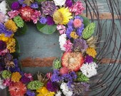 Handmade colorful spring dried flower and twigs garden wreath. All natural.