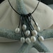 White pearl leather necklace, cascade style on brown leather