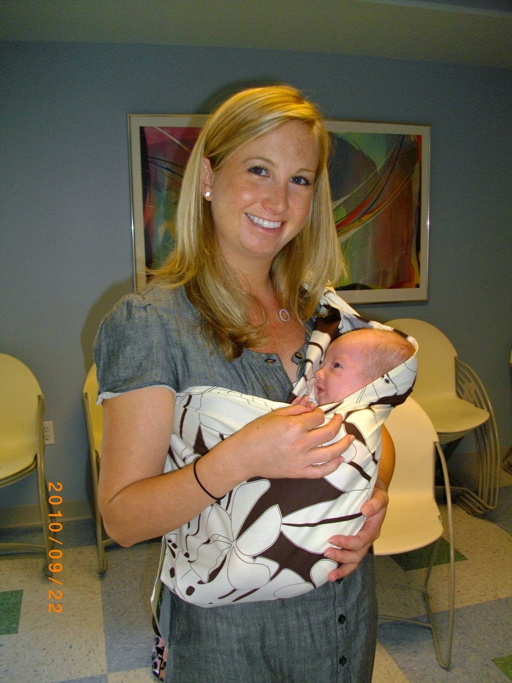 Make her life easier, get her a sling. Now she can do it. I love Slings