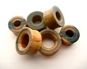 Wood plugs with crushed chrysocolla sizes 1/2 inch and up