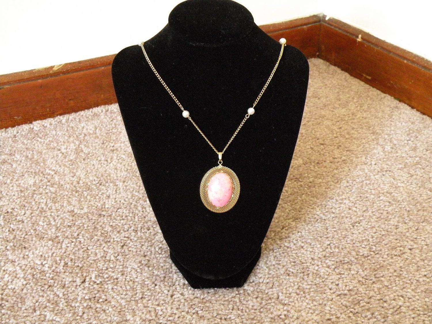 Vintage rhodonite pendant on gold and pearl chain necklace.