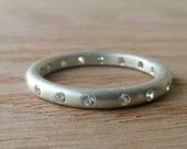 Moissanite and Silver Eternity Band