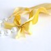 The Original Carrie Necklace in Sunny, a romantic yellow ribbon and pearl bridesmaid necklace