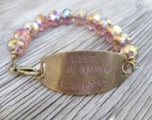 Hand stamped bracelet antique brass and Chinese crystals live love laugh