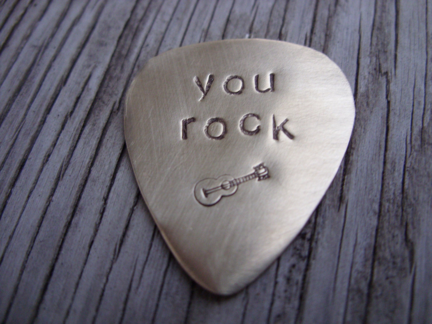 Hand stamped brass guitar pick- custom gift for a cool musician