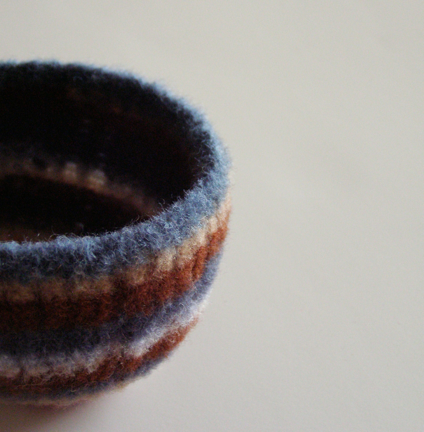 felted wool striped bowl - earth tone stripes of blue, brown, tan, nougat, chestnut, dark red, and yellow - desk organizer - back to school - theFelterie