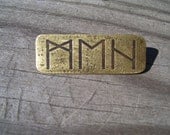 meh brass pin expressed in Elder Futhark Runes