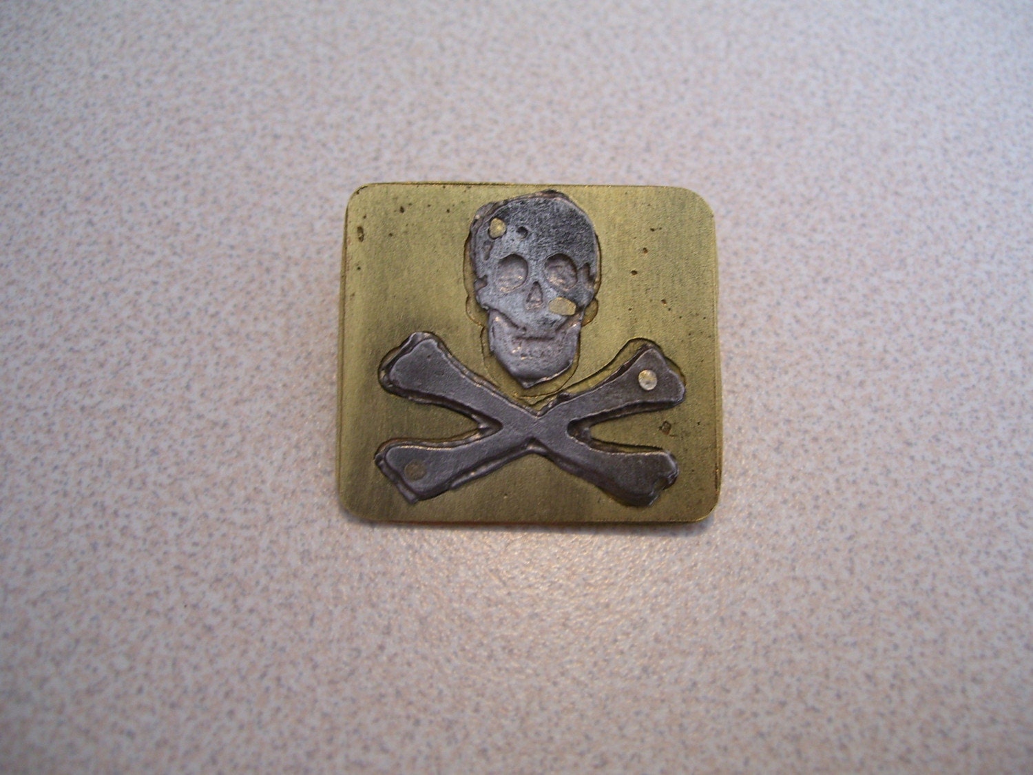Steel and Brass Skull and Crossbones Pin
