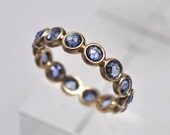 Light blue ceylon sapphire endless bezel ring - 18k gold