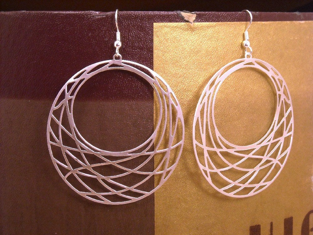 Silver hoop earrings.  Basket weaved hoops