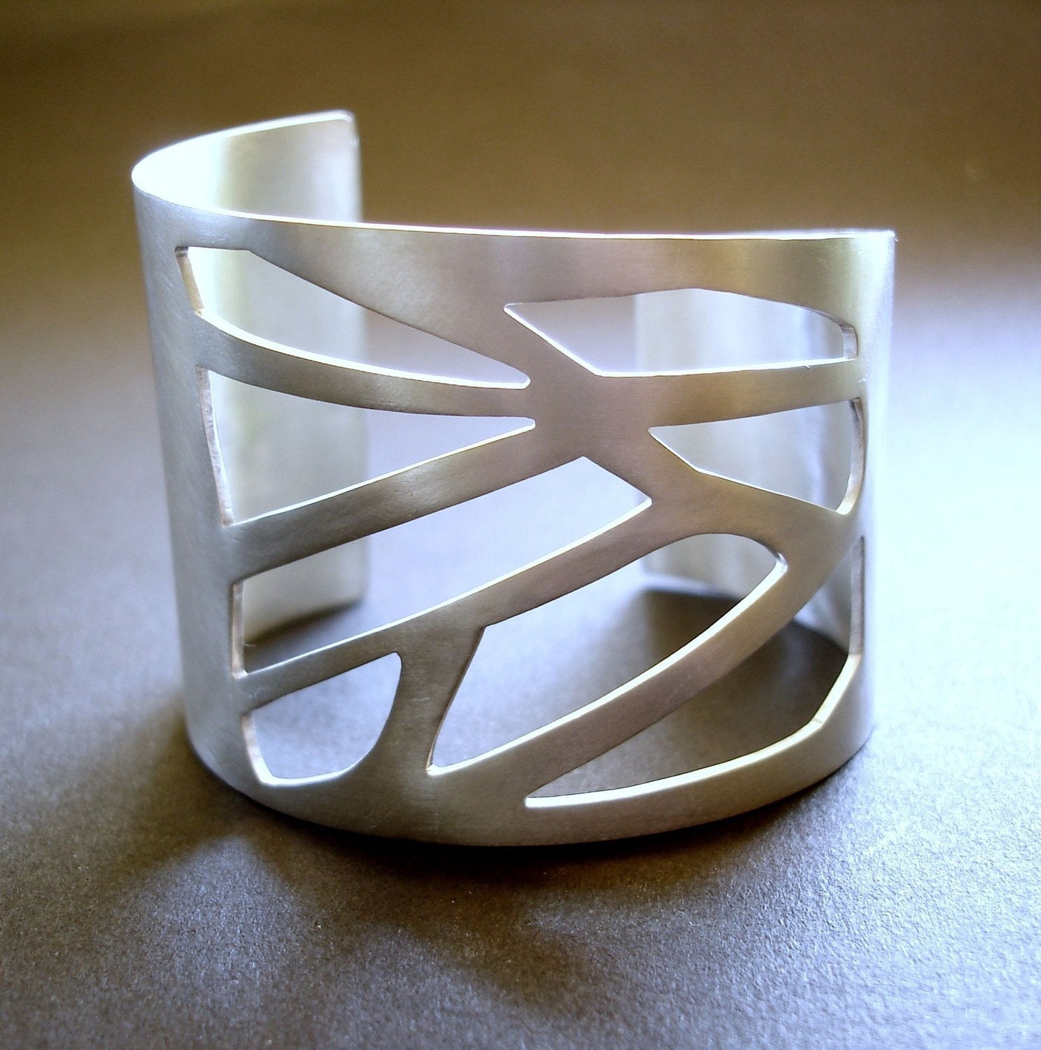 Large silver cuff with Cut-Outs geometric pattern
