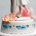 Adorable Leg Pop Ribbon Accent Cake Topper