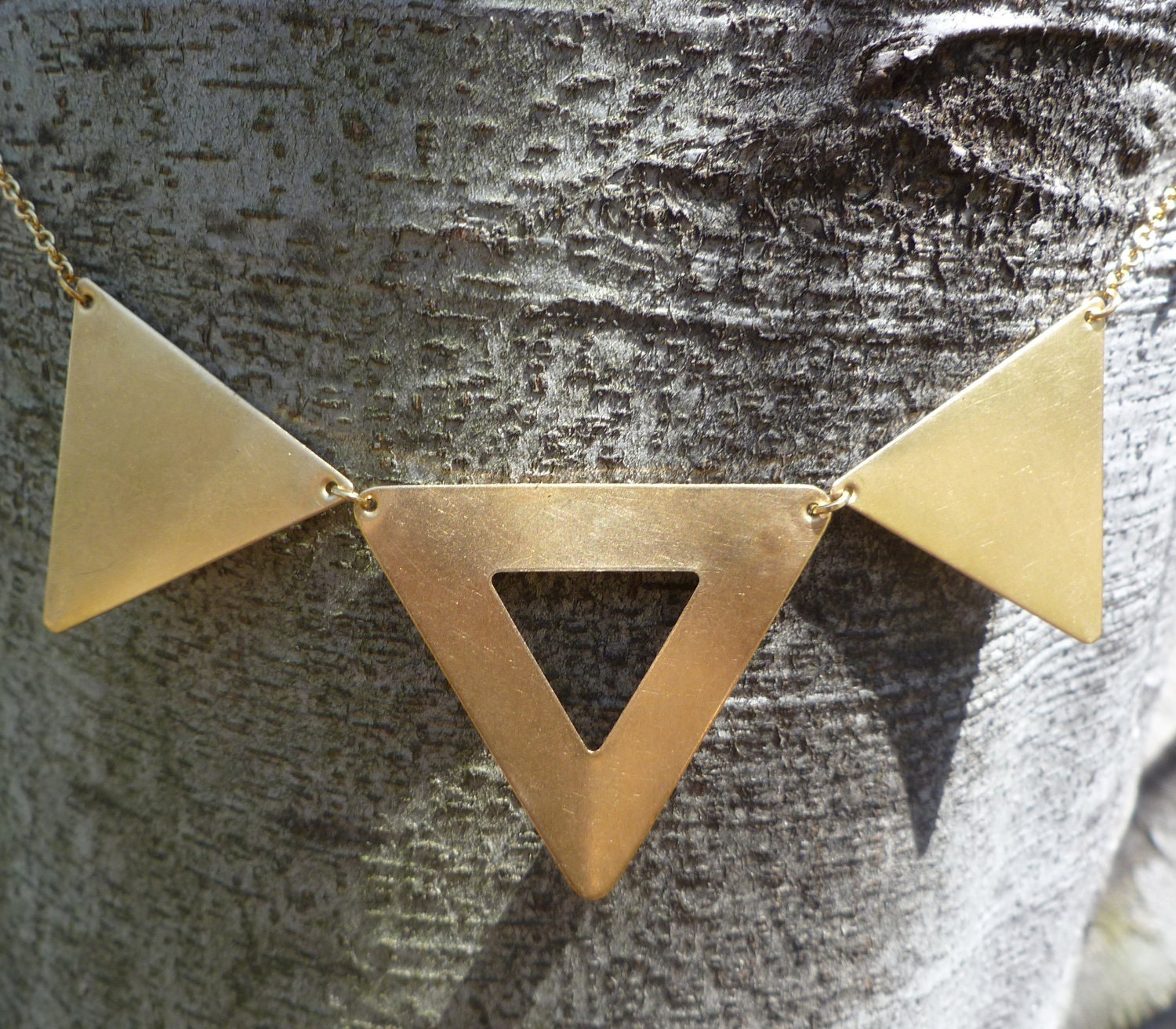 Triangle statement necklace, three brass triangles with cut out on long chain