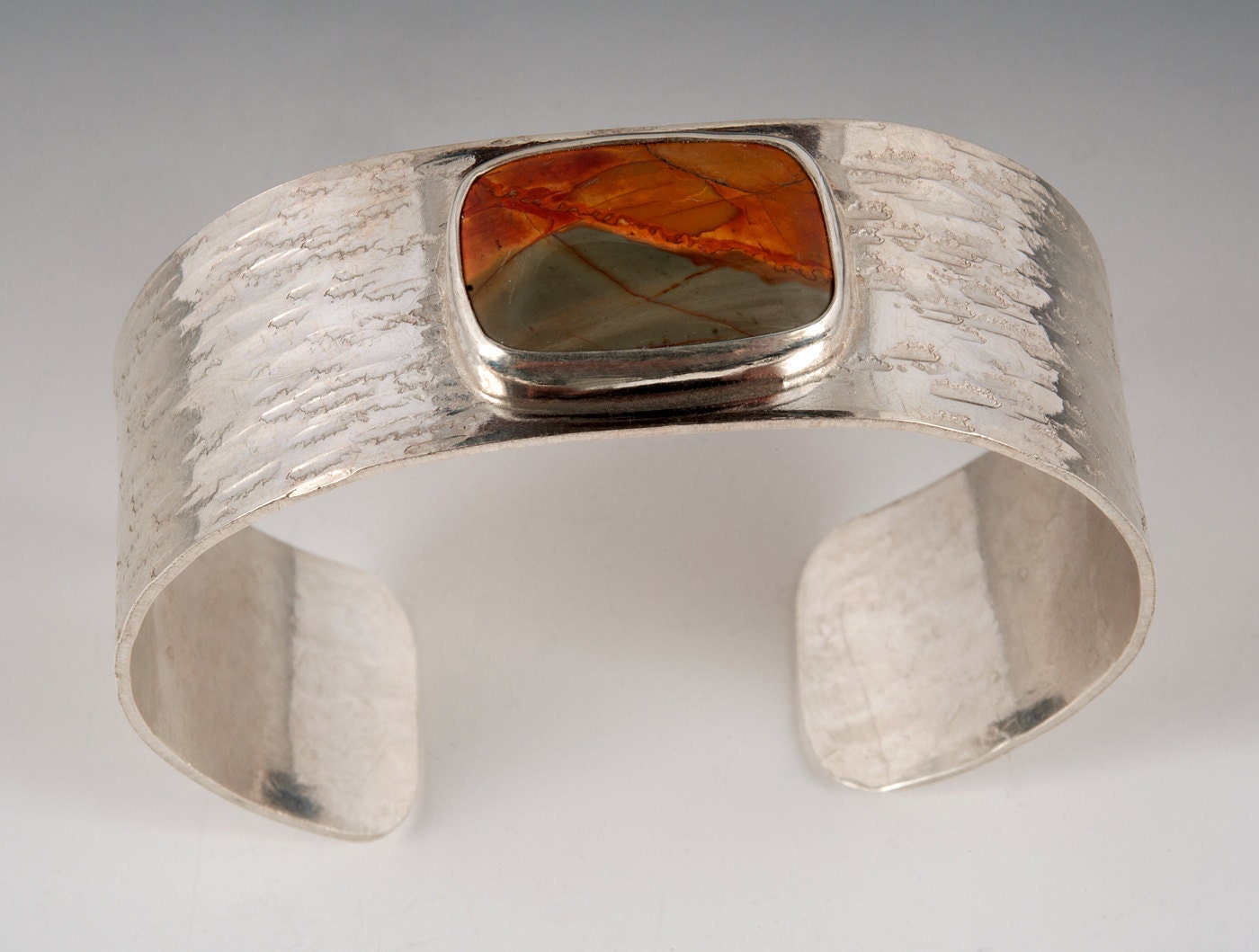 Hand hammered sterling silver cuff with red creek jasper cabachon