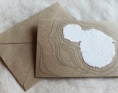 Blank Kraft Greeting Card with White Handmade Paper Shapes and Pen Drawing