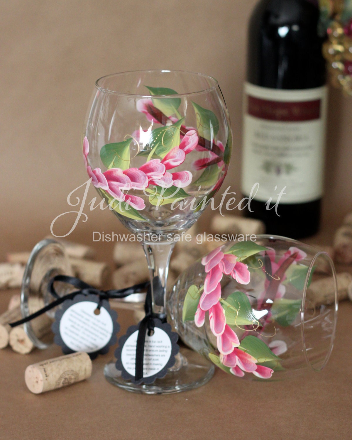 Hand painted wine glass in a magenta pink Wrap around floral design. FREE personalization and Dishwasher safe