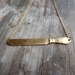 golden knife necklace