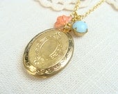 Golden brass locket necklace.  Coral flower and vintage turquoise stone.  Jewelry by Sweet And Simple.