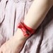 Coral patent leather - bow bracelet.