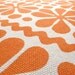 Parade print in Orange on Organic Cotton